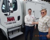 NW Abatement Services President Mark Stephens picking up his new American Caddy Vac in 2014 with American Caddy Vac Owner Mac Mattoon
